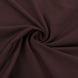 Vue macro détaillée de la texture du tissu tricoté marron foncé avec un design plissé élégant