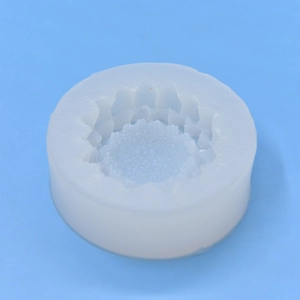 Translucent sunflower silicone mold for handmade soap and resin crafts on blue background