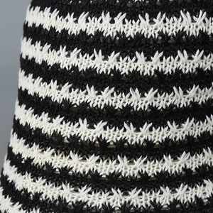 Japanese style black and white striped knit bucket hat featuring textured crochet patterns