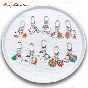 Set of 10 Christmas enamel keychains featuring Santa Claus, reindeer, and snowman charms