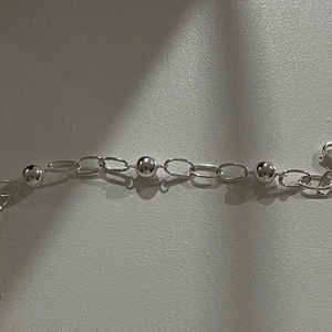 Detailed view of 925 sterling silver ball chain with polished metallic link structure