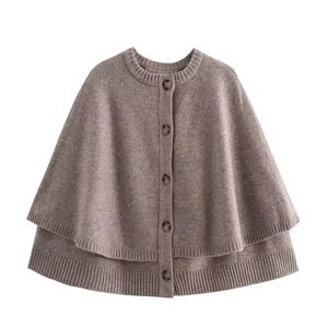 Coffee brown knit cape shawl with round neck and single-breasted buttons on white background