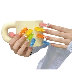 Handmade extra long press-on nails featuring colorful 3D gummy bear charms and pearls