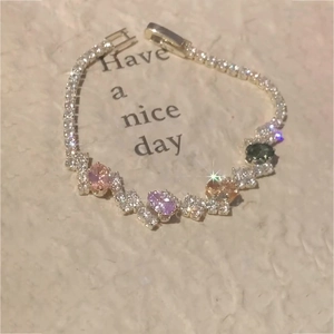 Detailed macro of a sparkling tennis bracelet with multi-color oval zircon stones