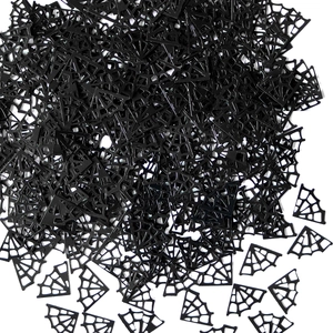 Close-up of black spider web shaped confetti for Halloween party atmosphere and decoration