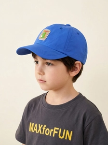 Close-up of blue kids baseball cap with cartoon dinosaur embroidery on a child model