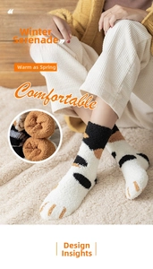 Detail of coral fleece cat claw socks showing thick plush texture and warm knit material