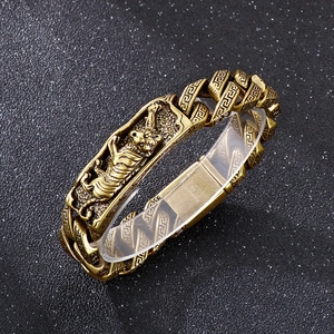 Detailed macro view of retro gold tiger head design on a 316L stainless steel Cuban chain