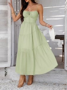 Elegant light green tiered maxi dress with spaghetti straps for summer vacations