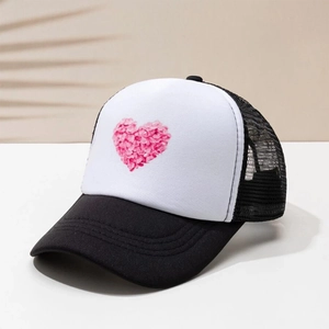 Summer truck hat with heart floral print and black mesh panels on beige background