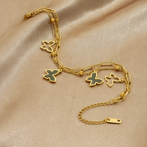 Double-layered gold stainless steel bracelet with hollow and black butterfly charms