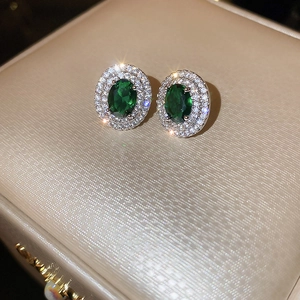 Vintage oval green gemstone earrings with double halo diamond setting in silver finish