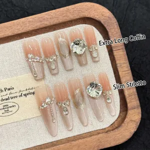Luxurious cat-eye press-on nails with diamonds and pearls in long coffin and stiletto shapes
