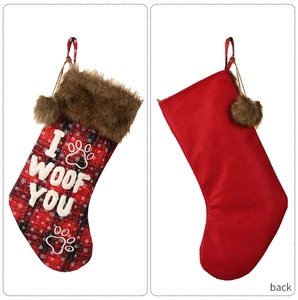Detail of red plaid Christmas dog stocking with faux fur trim and I WOOF YOU embroidery