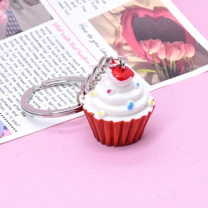 Cute heart cupcake keychain with red base and white cream swirl for dessert lovers