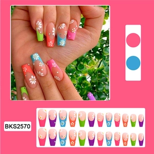 Macro detail of French floral press-on nails with rhinestones and 24-piece full set display