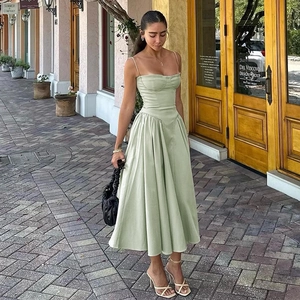 French vintage light green A-line midi dress with spaghetti straps and corset-style bodice