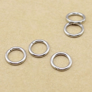 Macro shot of silver metal open jump rings for DIY jewelry making and connecting