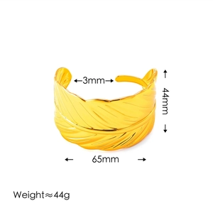 Golden feather cuff bracelet with detailed texture, 44mm wide adjustable open design