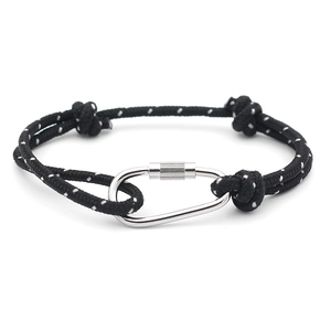 Detail of adjustable black woven rope bracelet featuring a polished silver carabiner clasp