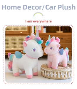 Plush unicorn dolls in white and pink with rainbow hair and glitter wings in home setting
