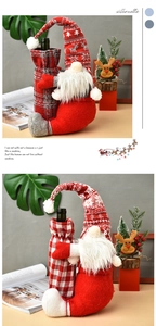 Close-up of handmade Christmas gnome wine bottle covers with red and grey plaid knit hats