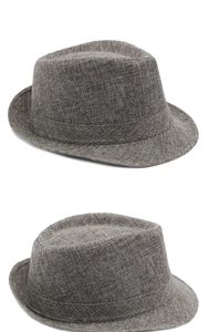 Close-up of melange beige fedora hat featuring natural fiber texture and decorative band