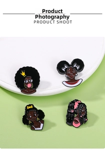 Set of four cartoon Afro girl enamel pins with colorful hairstyles and gold crown accents