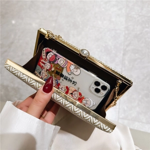 Elegant gold frame evening clutch bag with woven texture and detachable chain strap