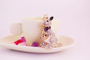 Detail of a sparkling kangaroo keychain with colorful rhinestones on a gold metal frame