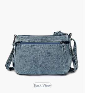 Blue denim crossbody bag featuring a functional back zipper pocket with tassel detail