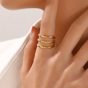 Three-piece 18K gold plated stainless steel ring set with smooth and twisted textures