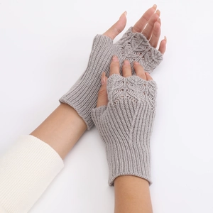 Close-up of gray knit fingerless gloves showing detailed fish scale pattern and soft texture