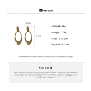 Detailed spec view of golden drop earrings with alloy material and 6.4cm size metrics