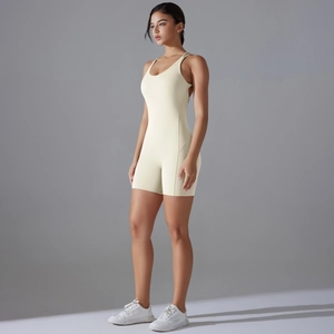Detail view of cream backless yoga jumpsuit with high elasticity and bodycon fit design