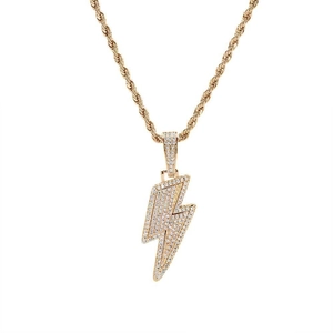Close-up of a golden lightning bolt pendant with clear zircon on a rope chain