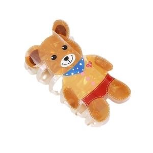 Detailed view of cartoon bear hair claw clip with star scarf and red shorts on white base