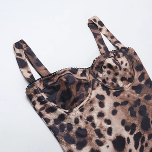 Detail of leopard print bodysuit showing bust stitch lines and narrow shoulder straps