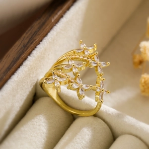 Macro view of gold plated flower ring with marquise zircon and multi-layer band