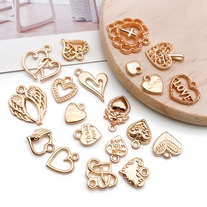 Variety of KC gold hollow heart pendants with LOVE engravings for DIY jewelry making