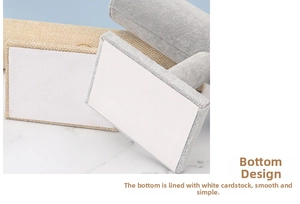 Detail of the display stand base with linen and velvet textures and flat paper backing