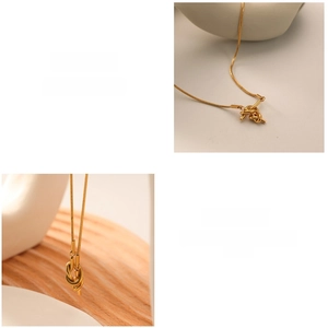 Detailed view of an 18K gold plated stainless steel sailor knot pendant on a snake chain