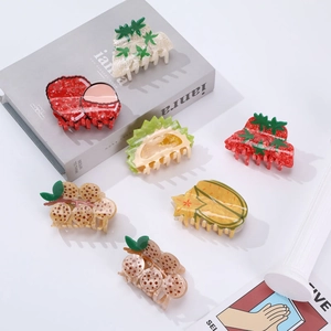 Minimalist assorted fruit-shaped hair claws including strawberry and lychee designs