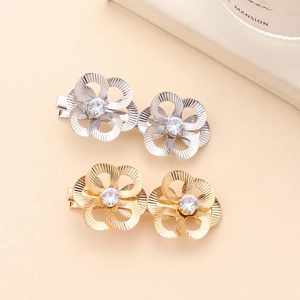 Baroque hollow flower hair clips in gold and silver with sparkling cubic zirconia centers
