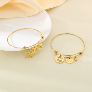 Adjustable golden stainless steel MOM heart bracelets set on elegant silk fabric