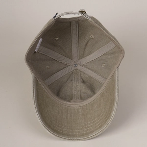 Detailed interior of cotton baseball cap with reinforced seams and adjustable metal strap