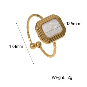 Detail showing dimensions of golden rectangular ring with white pearl shell inlay