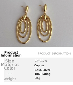 Detailed specs of vintage 18K gold-plated oval drop earrings with hammered texture
