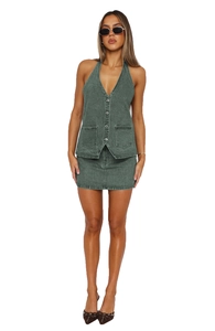Detail of washed green denim halter vest and mini skirt set with vintage buttons