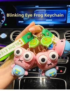 Dettaglio di portachiavi a forma di rana in rosa e blu con cinturini BLINK EYES e ganci